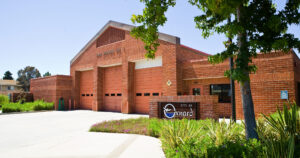 The front of fire station 1 is made of brick and has 3 large doors to project it's fire engines.