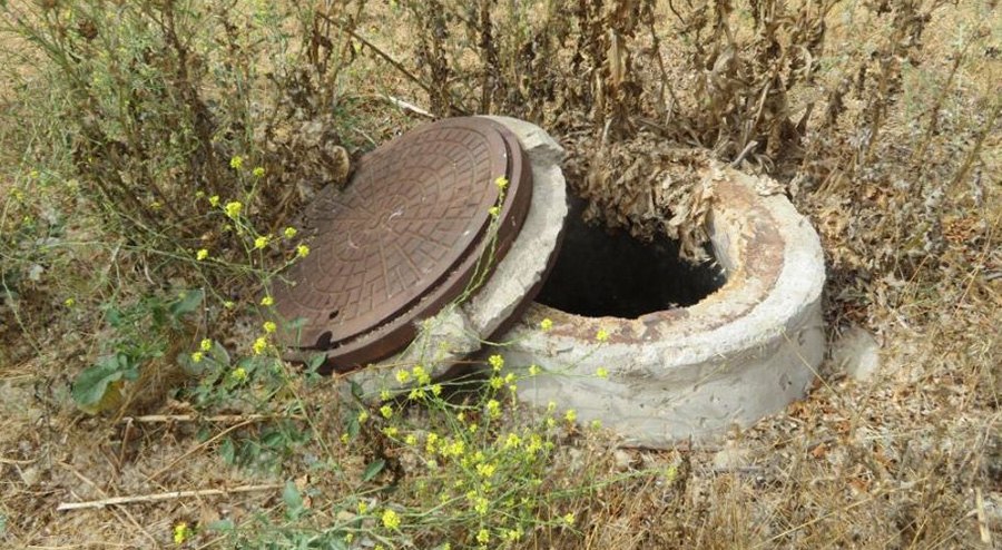 Open Sewer Manhole For Evaluation
