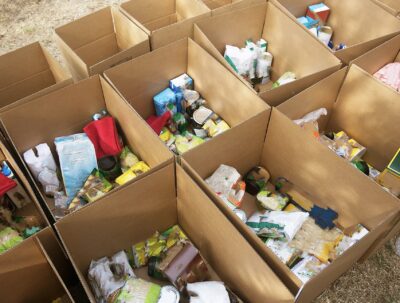 A bunch of boxes with door donations in them.