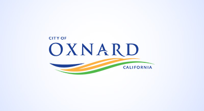 The Oxnard logo with a light blue gradient backgorund.