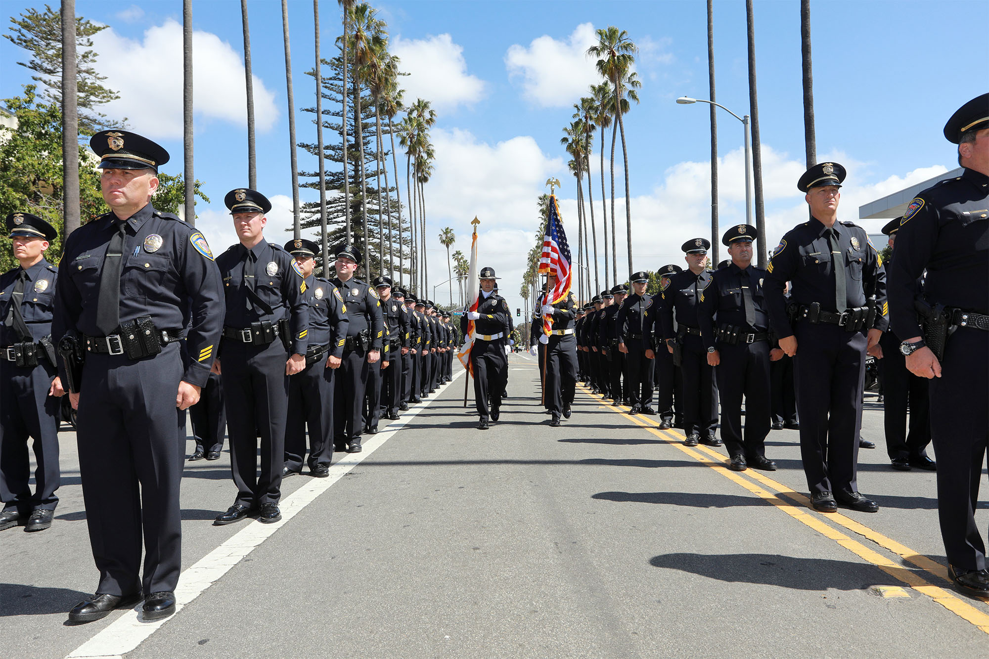 Police officers standing at formation during the Oxnard PD Memorial event.